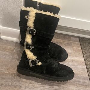 Size 6, black and white three buckle. UGG boots midcalf .